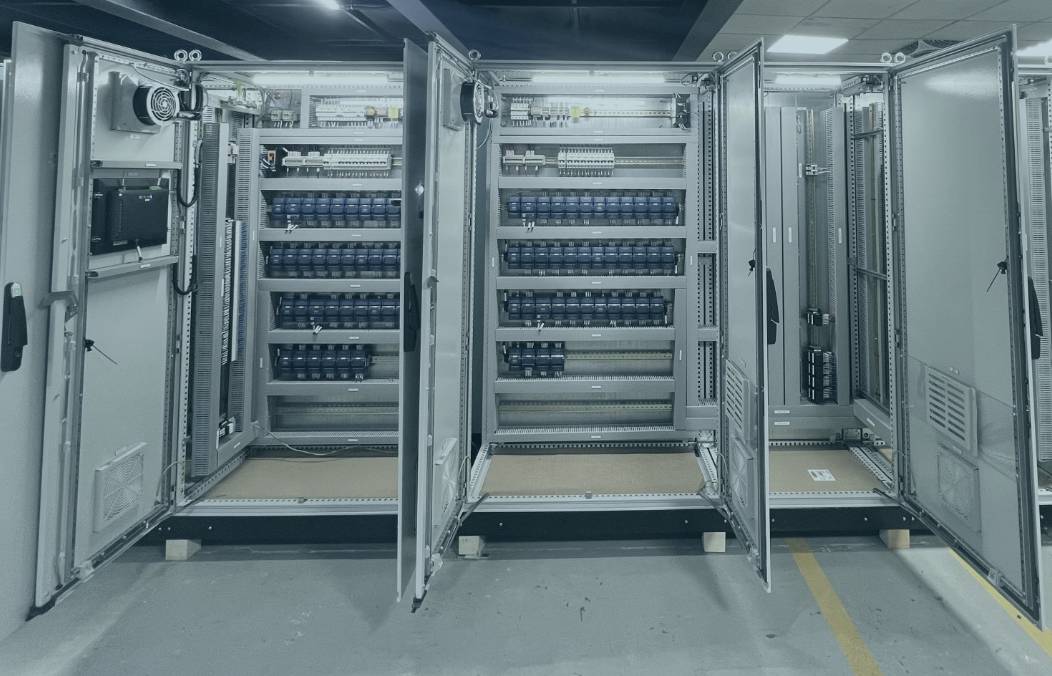 Row of open control panels during factory acceptance test